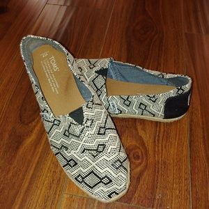 TOMS classic slip ons in Black and Natural.